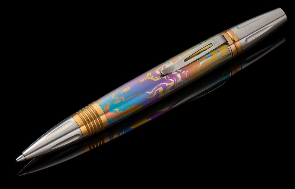 William Henry Caribe pen features a barrel sculpted and hand-finished from stylish patterned and anodized titanium  blue and gold color